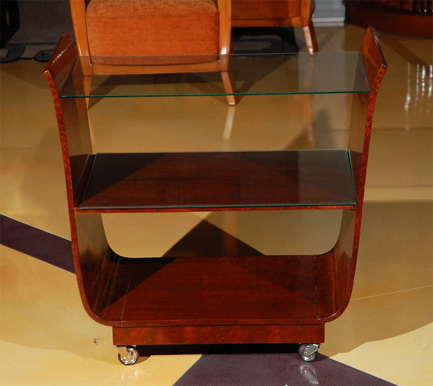 Art Deco, tulip shape, lacquered walnut rolling tea cart with glass shelves