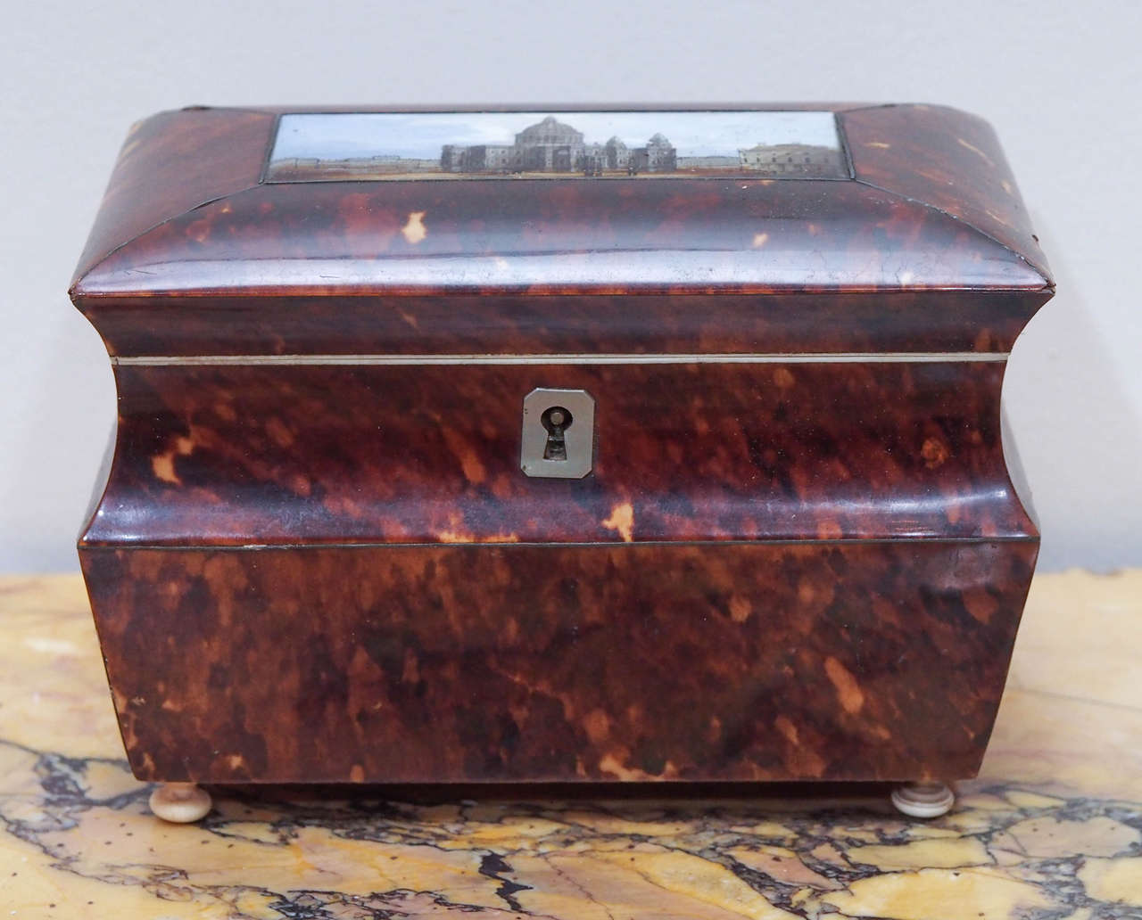 English Victorian Tortoishell Tea Caddy with Eglomise Panel with building.