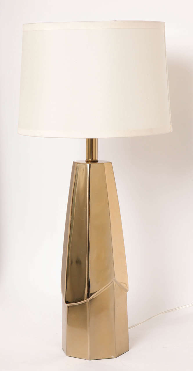 Pair of rarely seen sculptural brass lamps featuring two tiers of faceted brass.