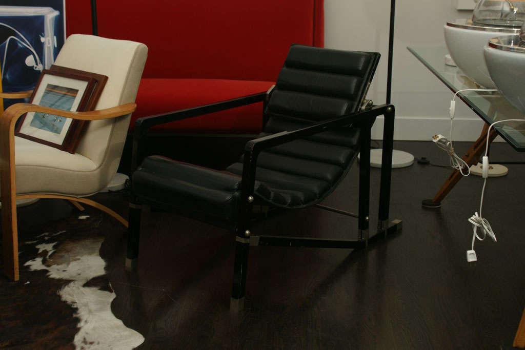 Black Lacquered Wood and Black Waved Leather.