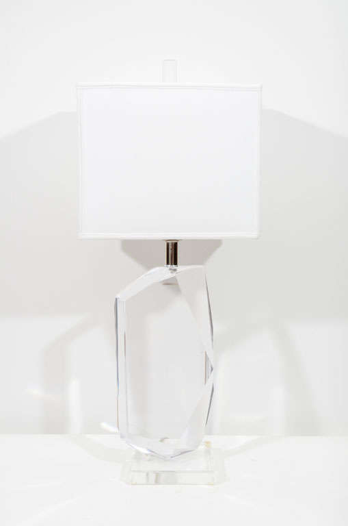 Fantastic pair of multi faceted thick lucite lamps by Van Teal.