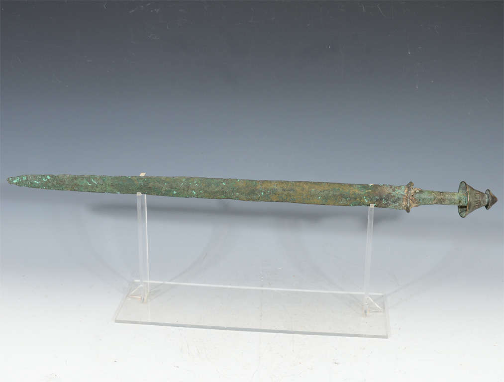 Original bronze cast archaic (traditional) sword made during the warring states period. Intact with more recent pommel (still quite old). This antique's beauty and age is evident through its natural deterioration and patination. Property from a New