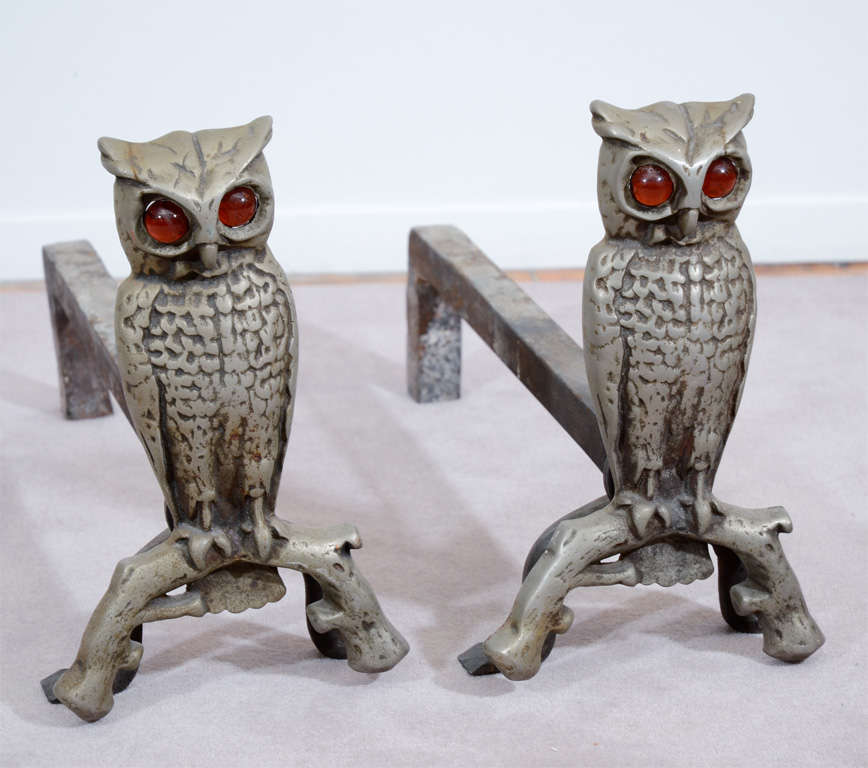 Owl andirons from the 1930's. Complete with amber glass eyes, each owl figure is perched on a branch.

Reduced from: $1,500