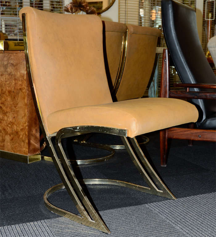Mid century set of six dining room chairs by designer Pierre Cardin. These elegant chairs are made from synthetic suede material and are trimmed in brass. <br />
<br />
Reduced From: $7500<br />
<br />
Paired with Pierre Chardin dining table: