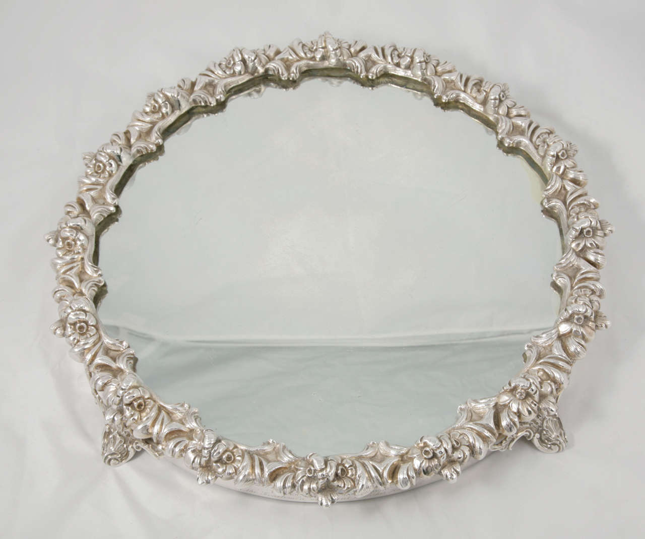 Silver and glass Victorian plateau, circa 1850. Beautiful and ornate, this can be used as a centrepiece for any dining table or as a display for crystal decanters and glasses.

Please contact us for shipping costs.