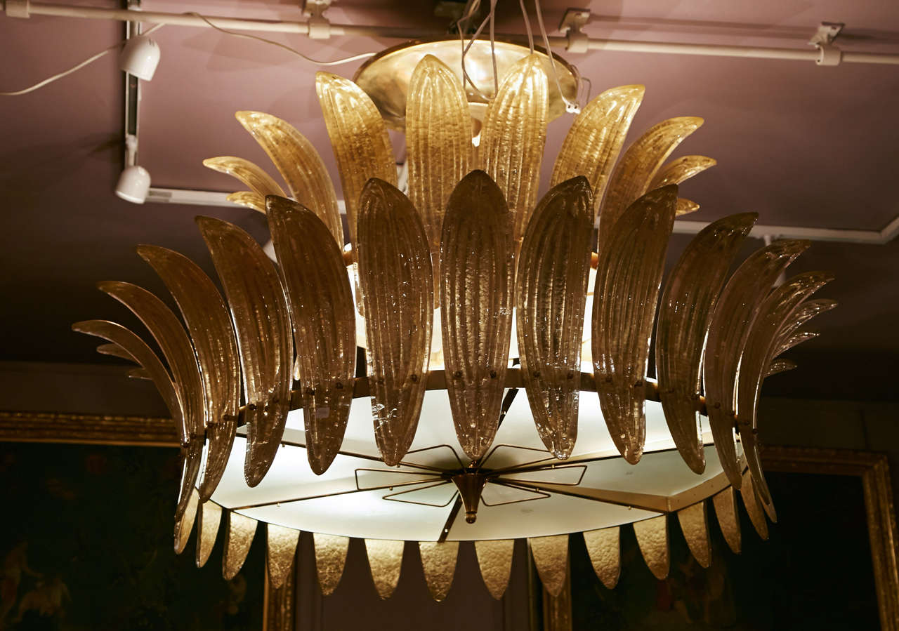 Pair of chandeliers with gold Murano glass leaves, structure in gilt metal.