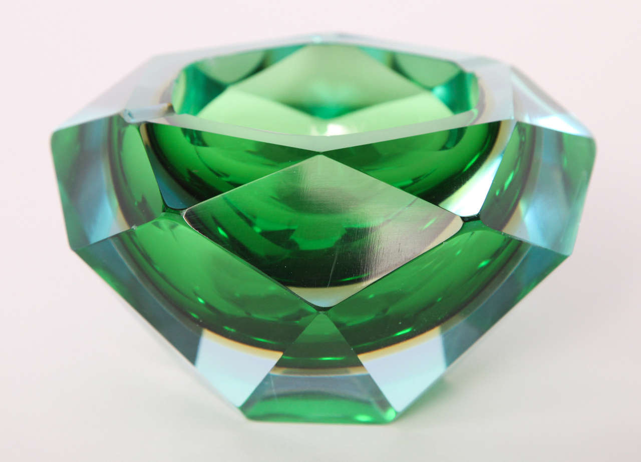 Dazzling green, Murano faceted glass ashtray with three divots on the rim to rest your cigarette. Excellent condition.