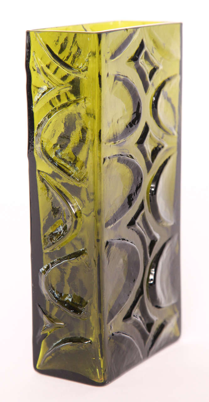 Slender, handcrafted glass vase in grass green with a delicate surface pattern of crescents and diamonds.