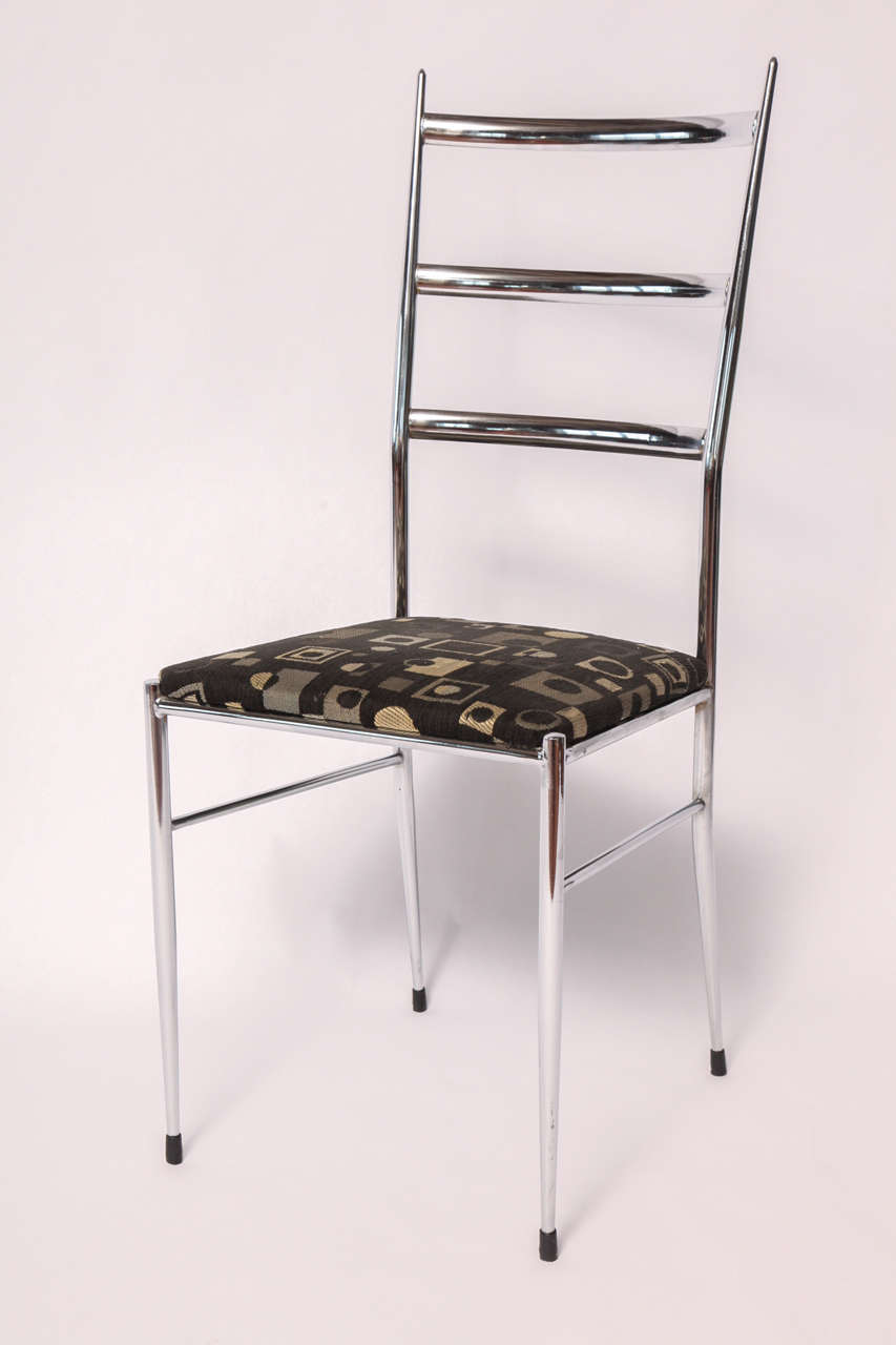 A pair of Ladder-back, chrome framed side chairs inspired by the very famous, Italian architect and designer, Gio Ponti. Indicative of his 