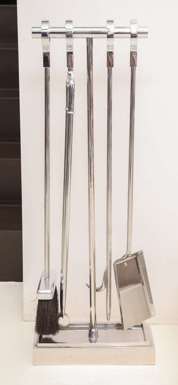 MICHAEL TAYLOR (1927-1986)
Set of 4 fireplace tools on stand, all in chromed metal. 
American, c. 1970