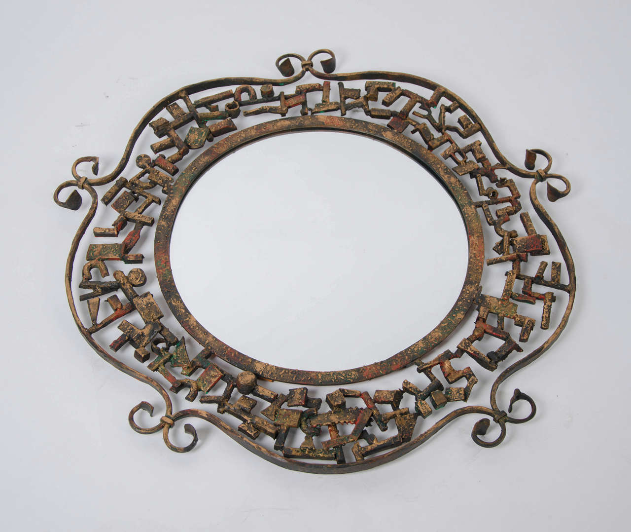 1970's round mirror in  metal sculptural frame signed Marsura
Also available coat hooks and umbrella stand.All pieces are in excellent original condition