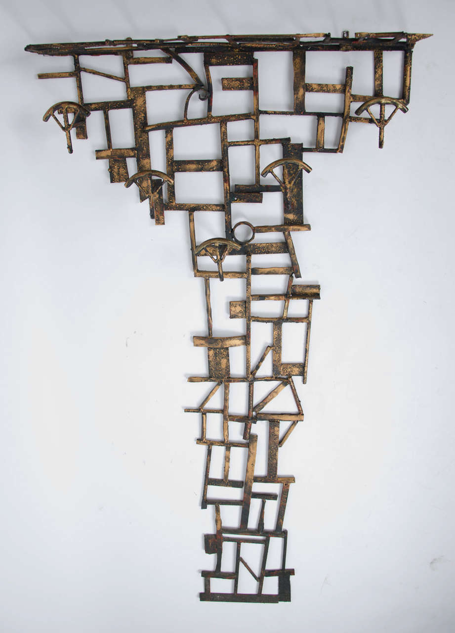 1970's sculptural italian metal coat hooks.Unique piece signed  Marsura
Also available matching mirror and umbrella stand.All pieces are in excellent original condition