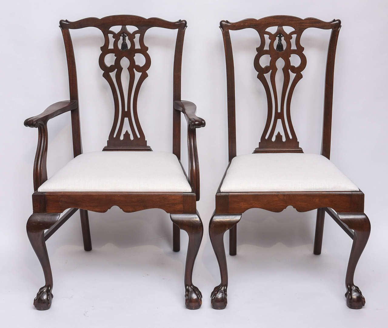 Rare set of six chairs consisting of a carver (arm chair) and five side chairs.  Well hand carved in mahogany with newly upholstered slip seats  Original restored finish

Originally $ 2,950.00

Side:   22