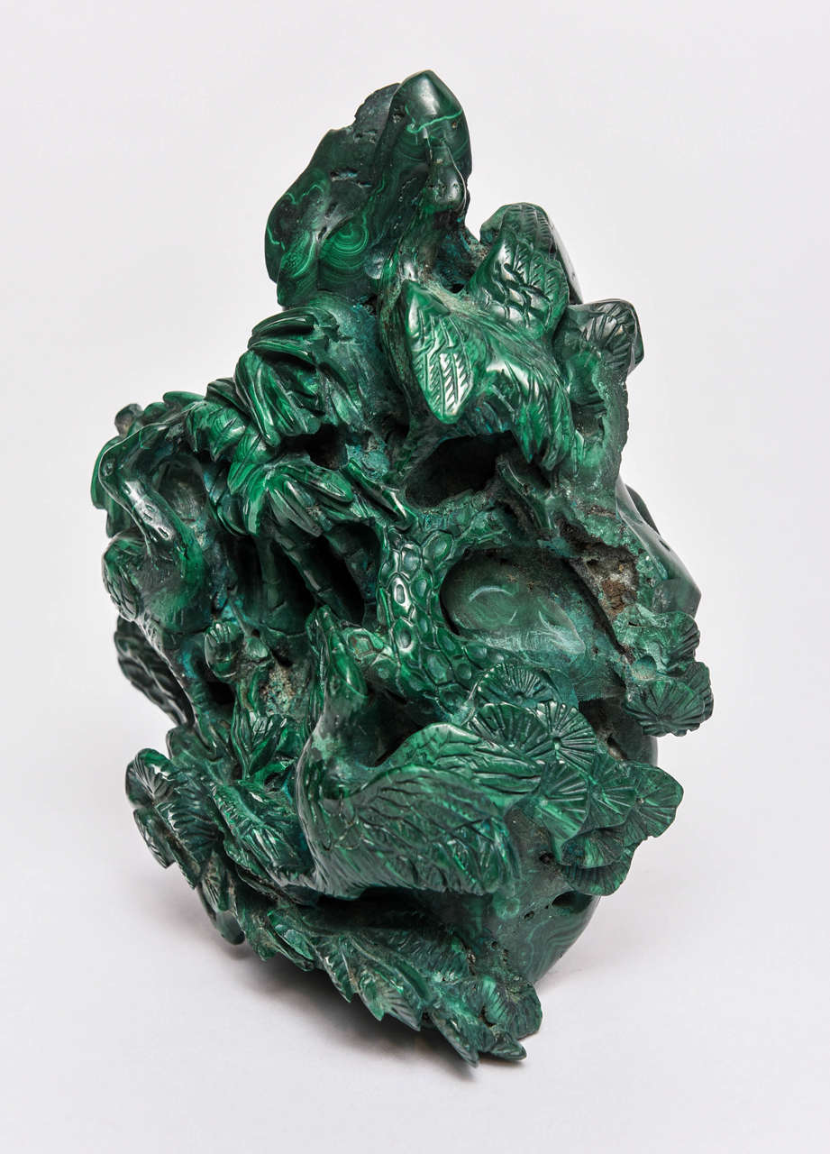 Hand crafted in malachite, it is detailed with flying cranes which is difficult to photograph but great in person.  It could be used as an art object or paperweight.