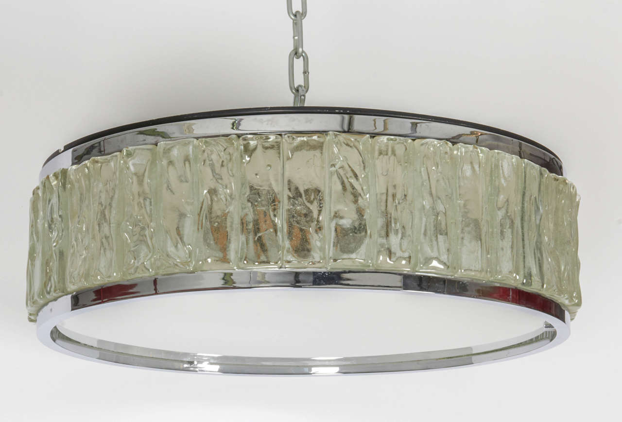 French Art Deco plafonnier by Jean Perzel. Comprised of a circle of rough laid glass slabs set between two nickel-plated brass mountings, 1950s.