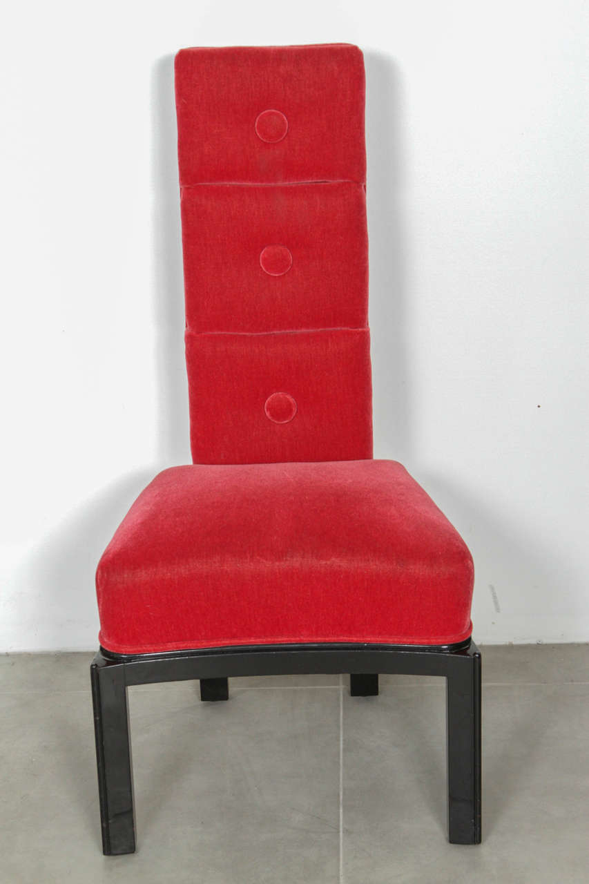 Elegant slipper chair by James Mont.
The chair is newly reupholstered in a Rich Red Mohair fabric and sits on a black lacquered base.