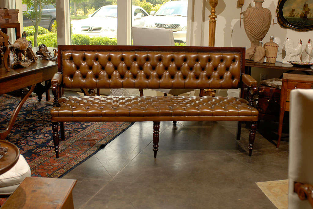 Pair of English Benches with new leather upholstery.