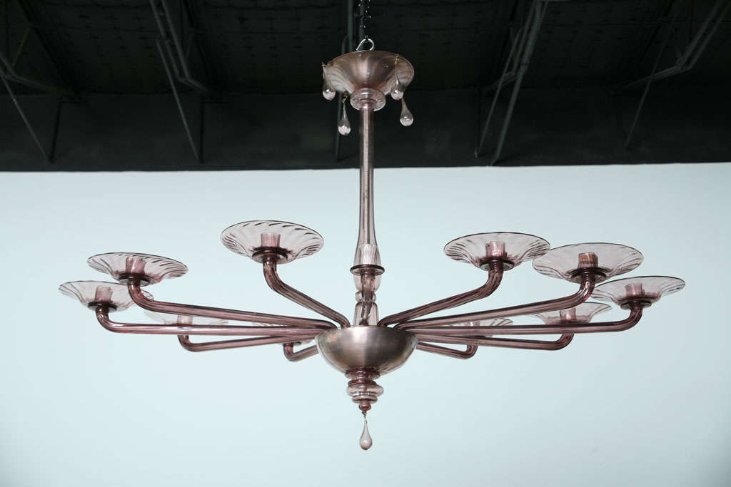 Chandelier of typical form with elongated arms.