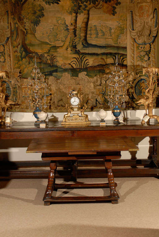 A rectangular walnut table with turned legs and stretcher.

William Word Fine Antiques: Atlanta's source for antique interiors since 1956.