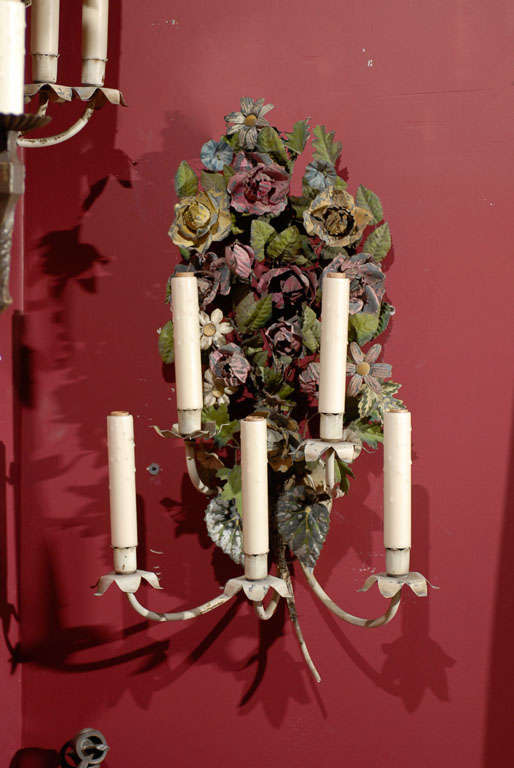 Pair of floral painted tole sconces with five lights, now electrified.