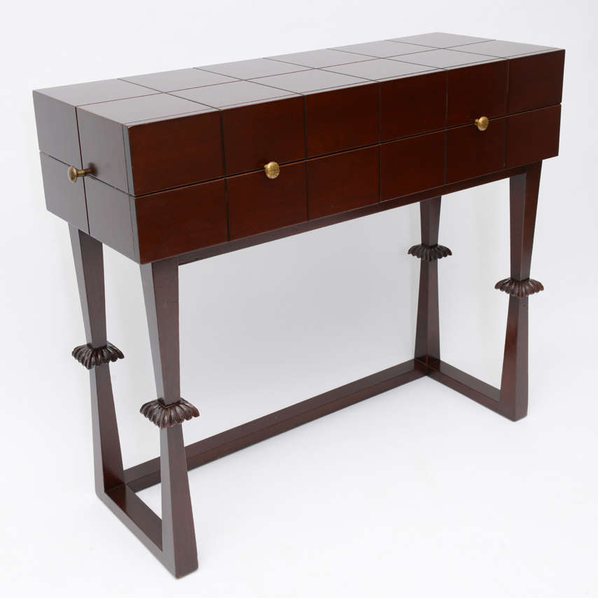 Tommi Parzinger Serving Commode Model#862
manufactured by Charak in 1940.
carved mahogany
1 drawer over 2 accented with split brass handles.
Marked Charak Modern