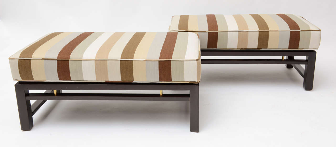 Pair of Edward Wormley Benches model#286 manufactured by Dunbar furniture.
Mahaogany and brass accented bases
recovered in in vintage alexander girard striped fabric.