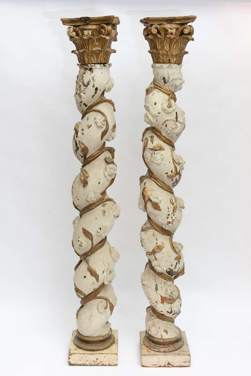 Pair of carved wooden barley twist columns from the 19th century.