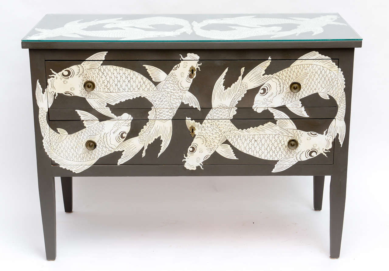 Wonderfully unique two drawer hand painted chest featuring koi fish. Original papered drawer interiors.