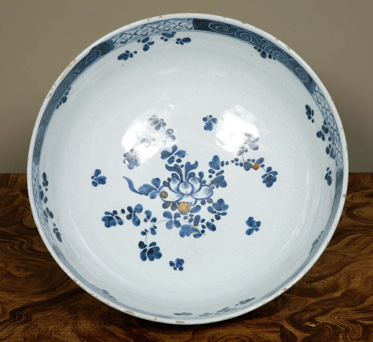 A good sized mid 18th century English Delft, (probably Mortlake), punch bowl. This large bowl, is freely painted inside and out with rocks, trees, oriental pavillions and sprays of flowers in the Chinese style. Condition, minor rim chips, some glaze