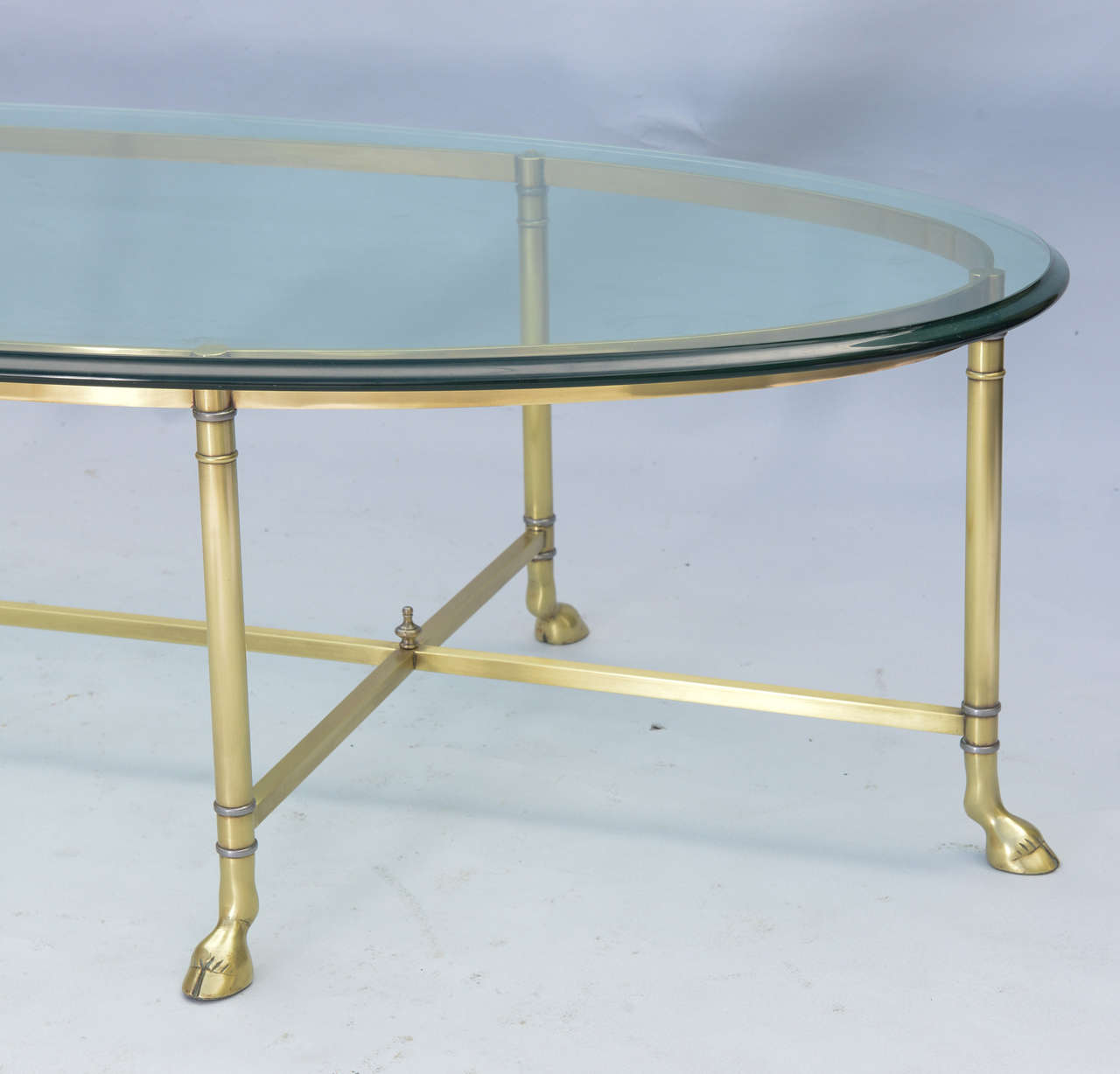 Polished Brass Cocktail Table with Oval Glass Top at 1stDibs
