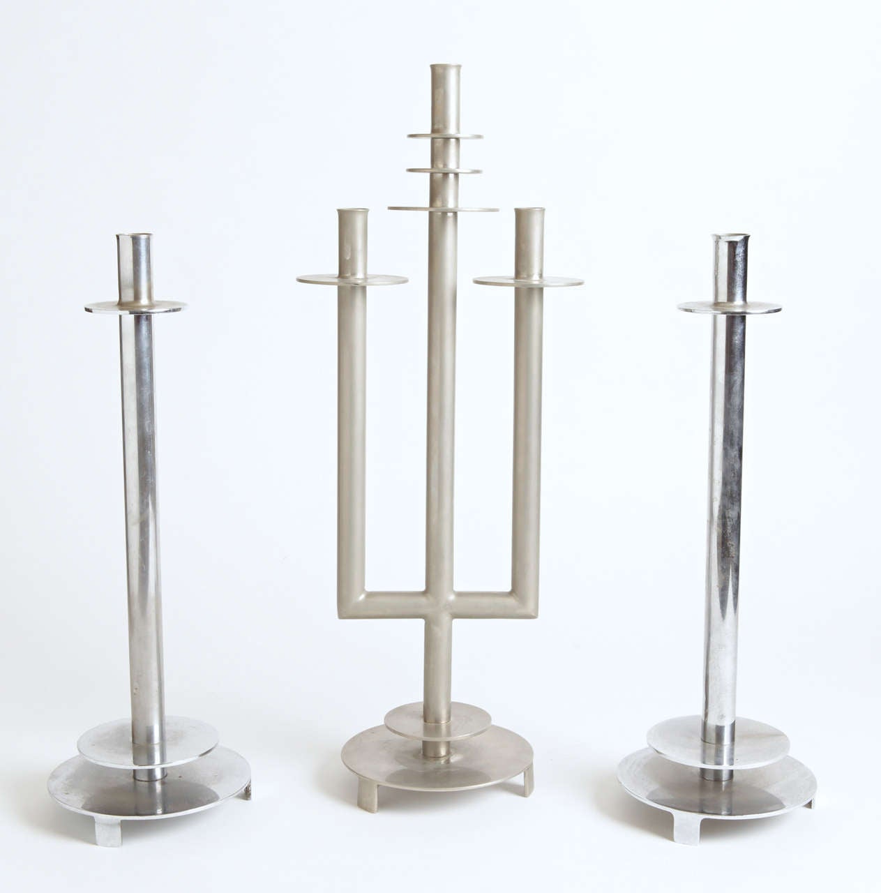 Pair of 1930s single tube candlesticks and three tube centerpiece.
See 