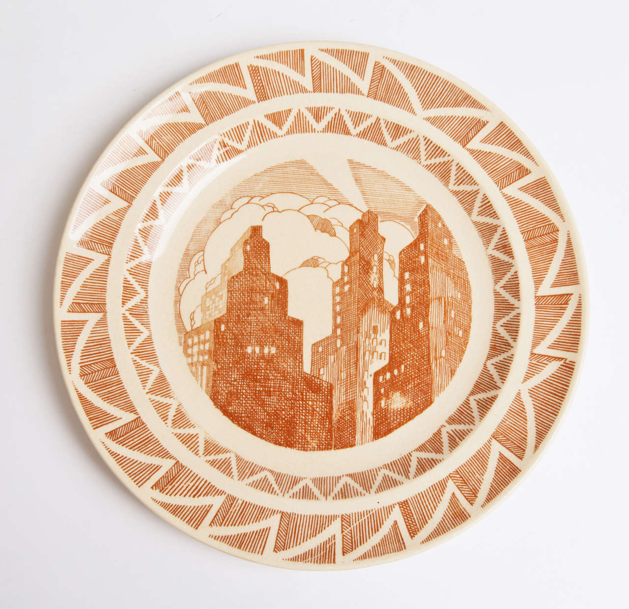 Important Art Deco skyscraper plate, Gale Turnbull for Leigh Potters, circa 1929

Truly rare example of the early American skyscraper design motif, typically found only in the wood-cut machine age art renderings by Howard Cook and reminiscent of
