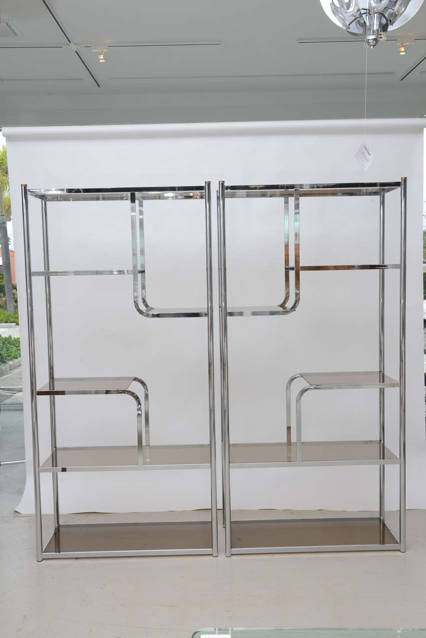 Pair of mod chrome etageres with smoked glass shelves.