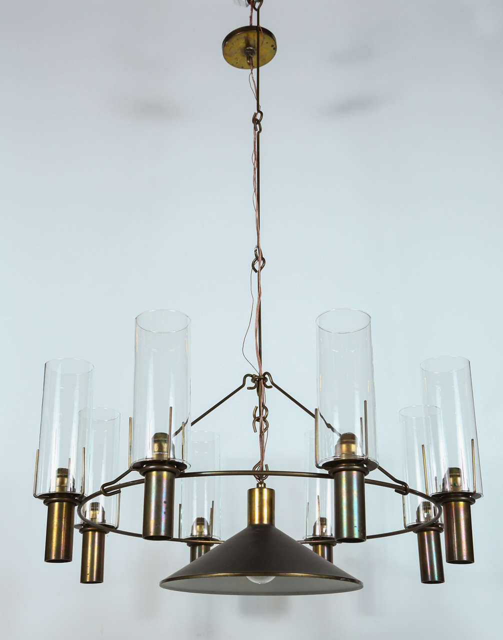 Bronze and glass chandelier by Stuart Barnes for Robert Long Incorporated. Includes eight hurricanes and a downward facing light from 1976.