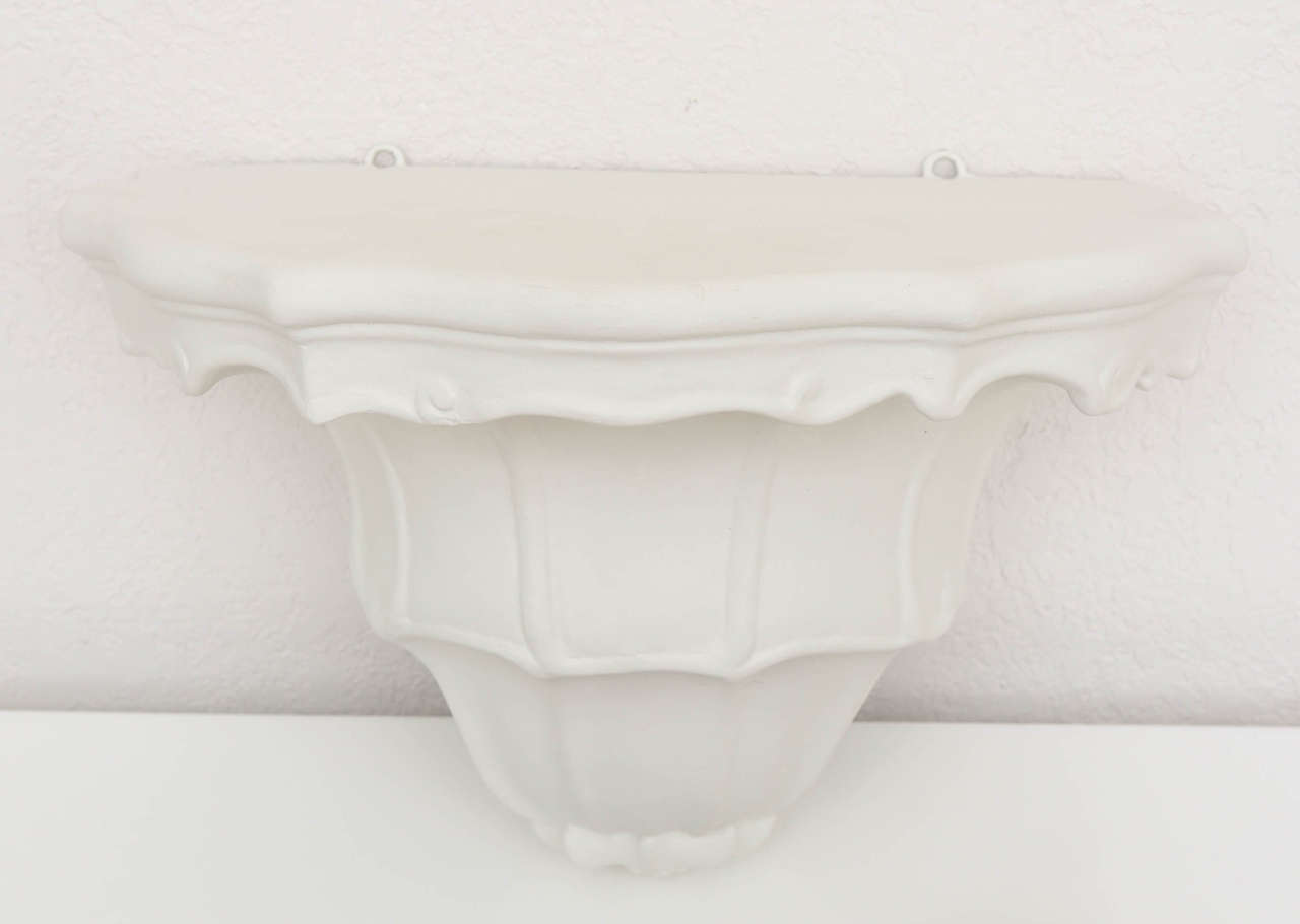 Vintage pair of white plaster wall brackets with scalloped details.

Please feel free to contact us directly for the best price, a shipping quote and any additional information by clicking 