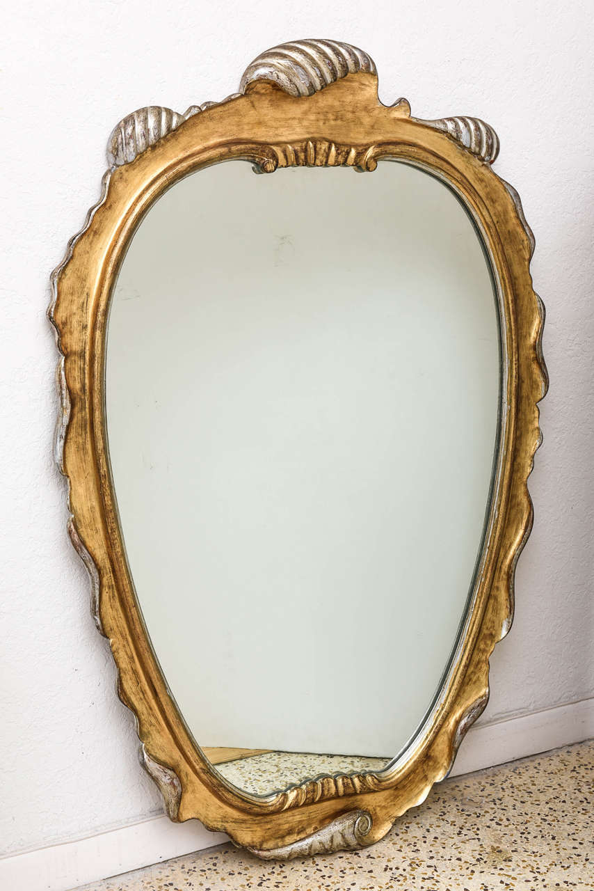 Italian gilt scrolled wall mirror in the manner of Dorothy Draper.

 