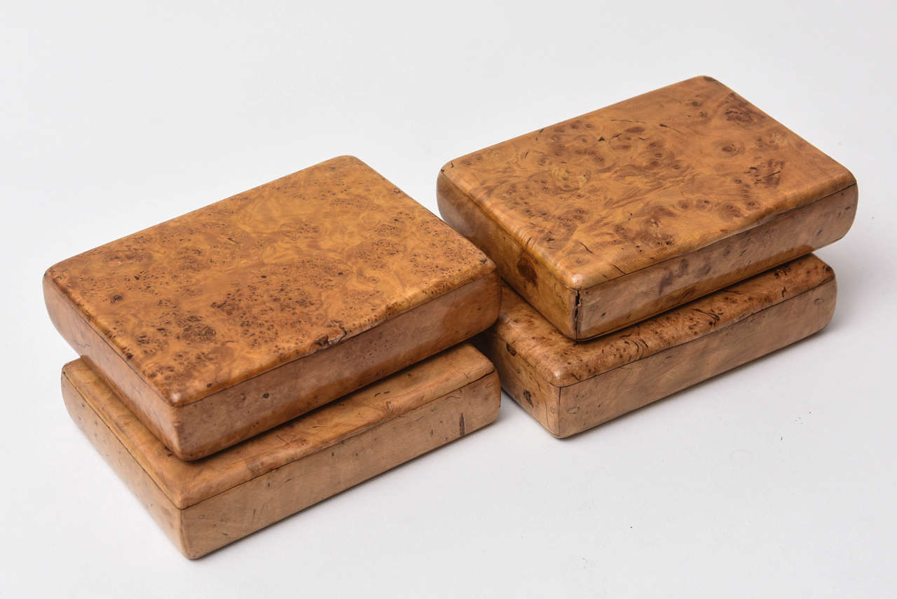 Set of four cigarette cases from Russia. Made in exotic amboyna wood.
In one box is a paper tag, Made in Russia.