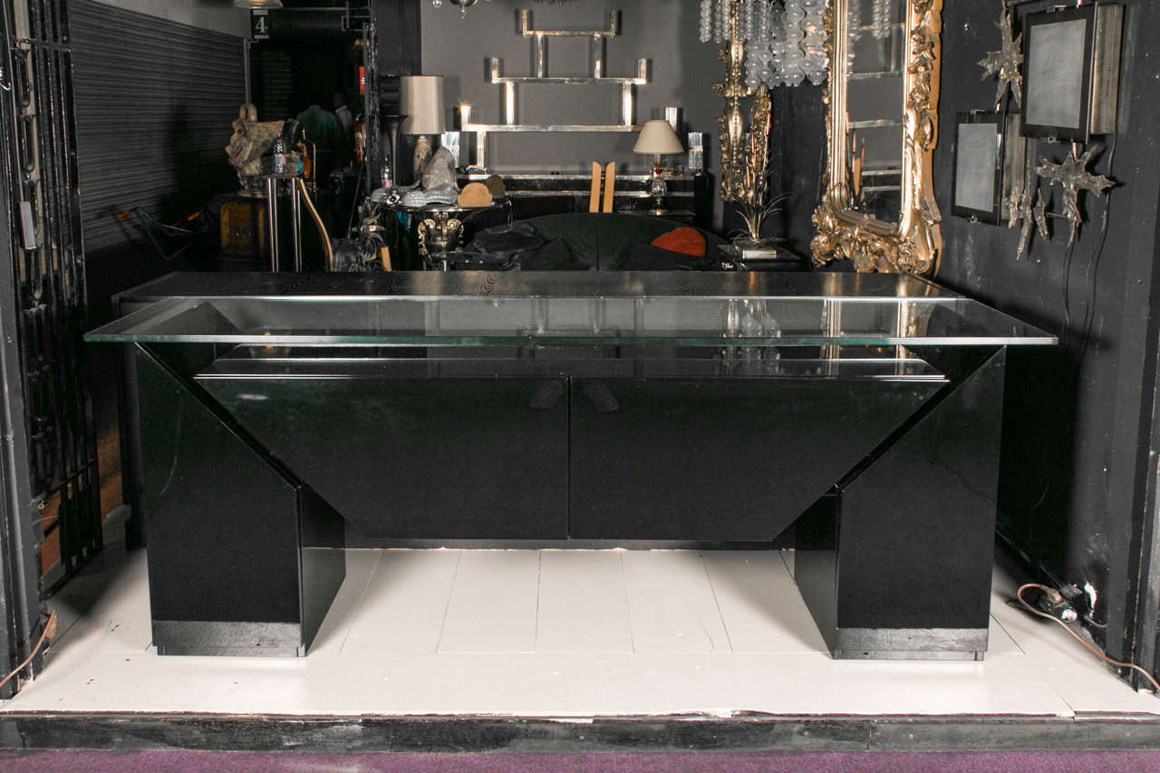 Black lacquer buffet covered with a thick glass top, 1980s.