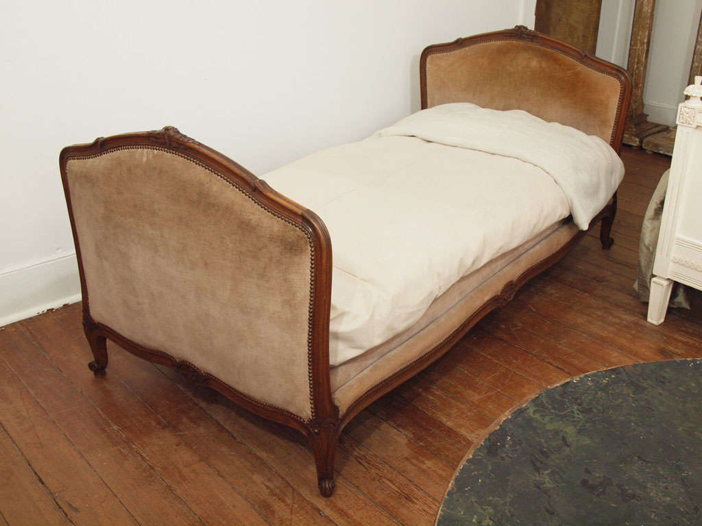 Carved and stained beechwood daybed with attractive lines.