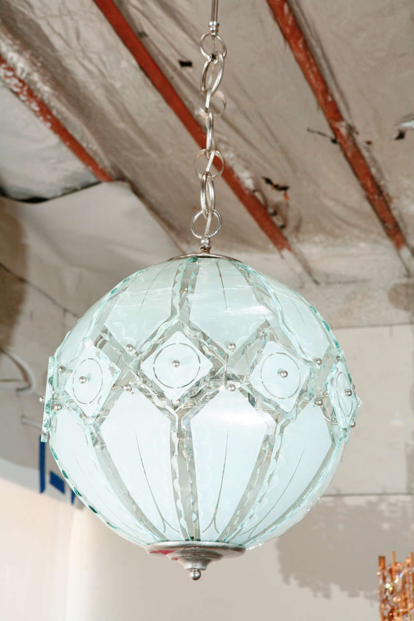 Wonderful globe chandelier. Fontana Arte.
Visit the Paul Marra storefront to see more lighting including 21st Century.