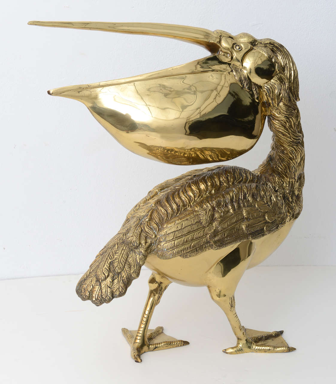 This stylish sculpture of a pelican will make the perfect addition to your home for a bit of the exotic and glamor of the Hollywood Regency, Boho look.

Please feel free to contact us directly for a shipping quote or any additional information by