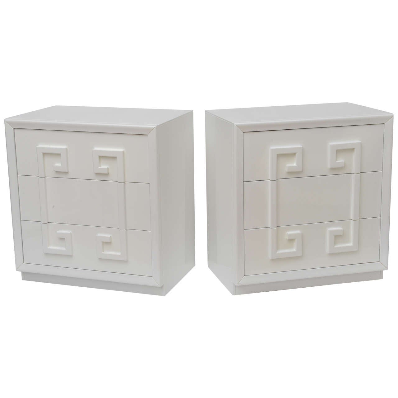 Pair of three drawer bachelors chests superbly finished inside and out in high gloss white lacquer. Greek key raised design, in the Kittinger style, incorporates all three drawers and evokes memories of a bygone era of glamour and high style. Great