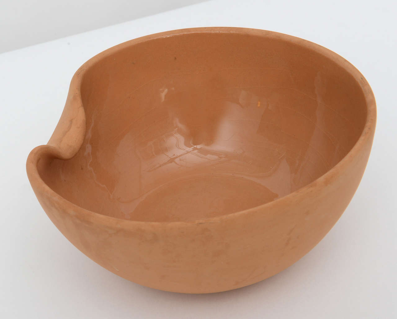 Terracotta bowl designed by Elsa Peretti for Tiffany & Co. Contrast interior glazing with raw exterior. Made in Italy marked and signed.
 