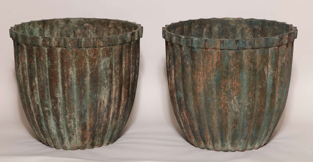 Heavy solid bronze jardinie`res weighing 80 pounds each with fluted sides.

(Price shown is reduced price, no further trade discount) 