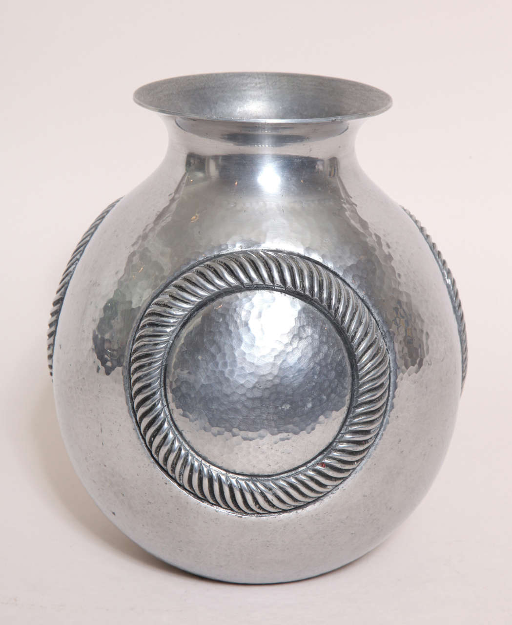 Aluminum vase with circular ridged design on three sides.

Signed:  R Delavan/ Impressed underneath: R Delavan Decorateur Paris/ Depose

*Variety of other Rene Delavan pieces available.

(Price shown is reduced price, no further trade discount) 