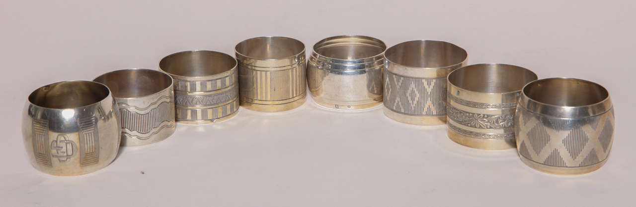 Top to bottom, left to right:

#713 silver napkin ring
by Ravinet d'Enfert
France, 1920s
Impressed with Minerve for 950 silver/ Ravinet d'Enfert poincon RD three leaf clover

#10 silver napkin ring
by Nidenhout Fres
France,