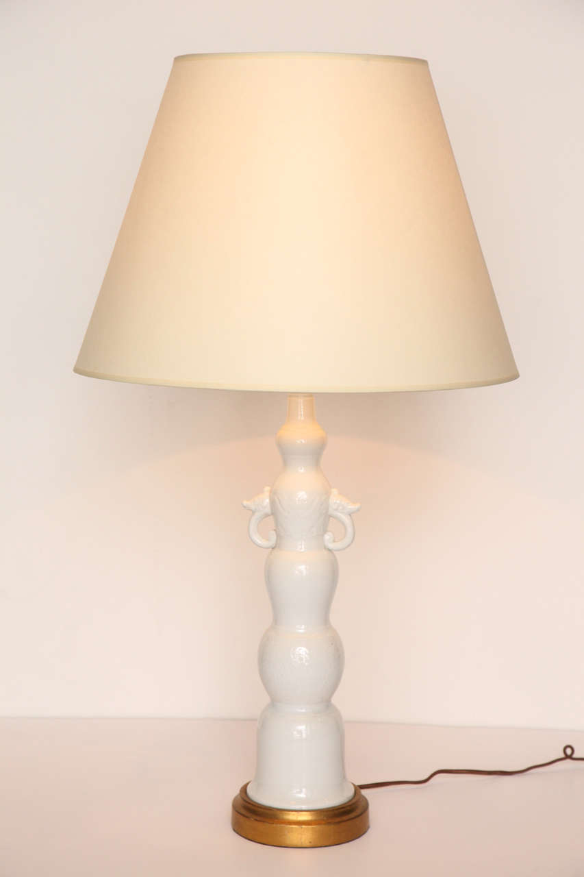 Pair of glazed porcelain table lamps with gilt bases
