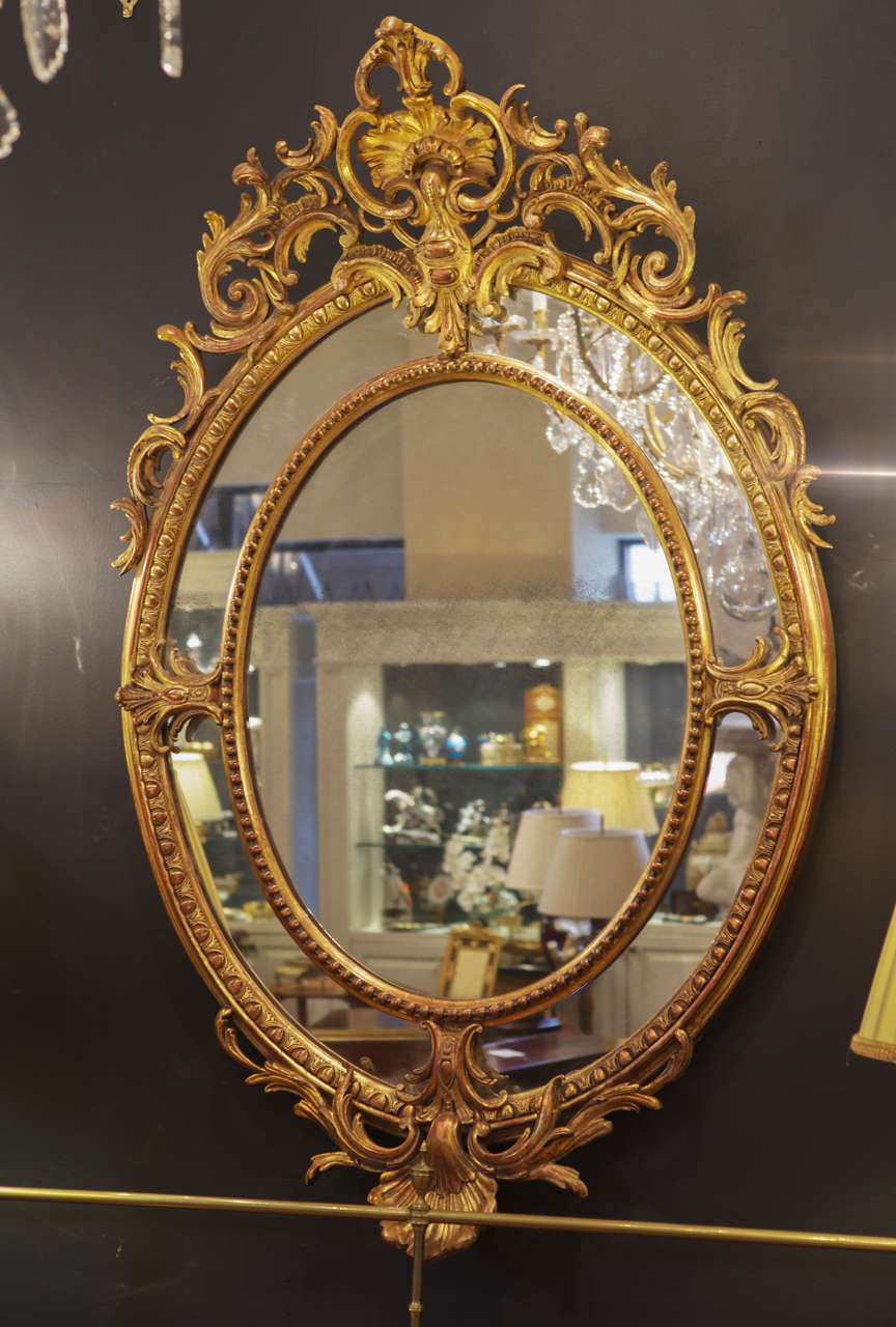 19th c French Louis XV gilt carved oval mirror In Excellent Condition In Dallas, TX