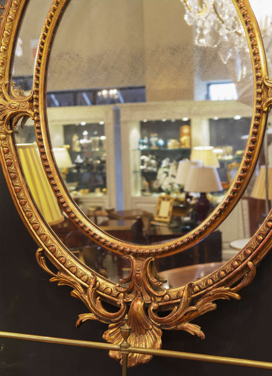 Wood 19th c French Louis XV gilt carved oval mirror