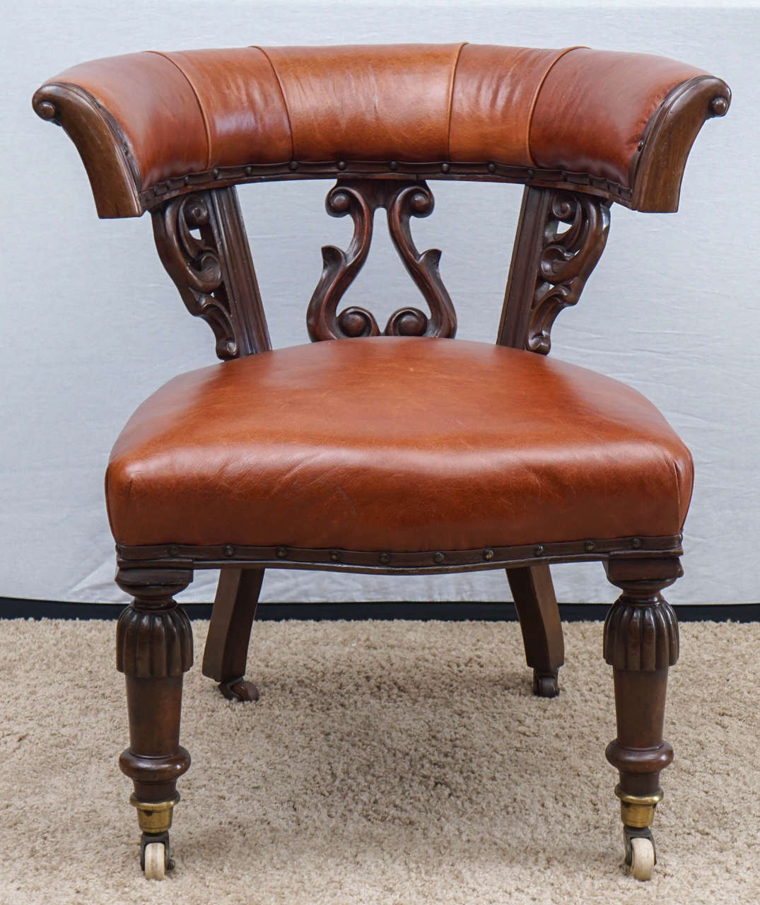 This wonderful leather and mahogany chair is as lovely as it is useful. As an accent or desk chair, the piece shouts English elegance. The reviews are mixed about the seat, some who sit think the seat needs new springs, while others find it
